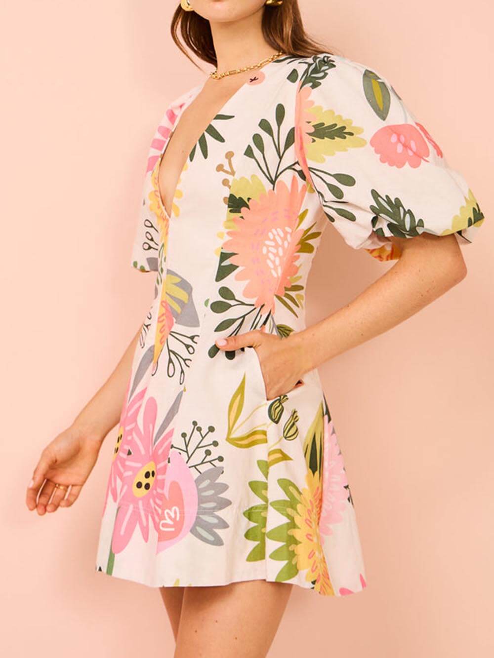 Mini dress with puff sleeves, floral print, and pockets