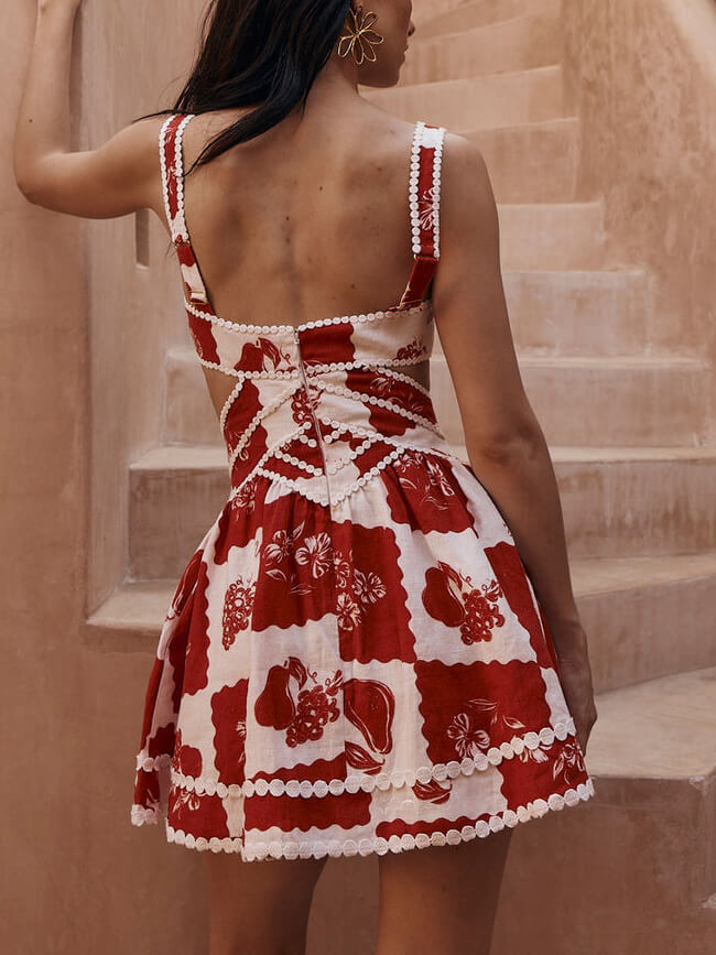 Minidress with geometric pattern, embroidered details, and cut-outs