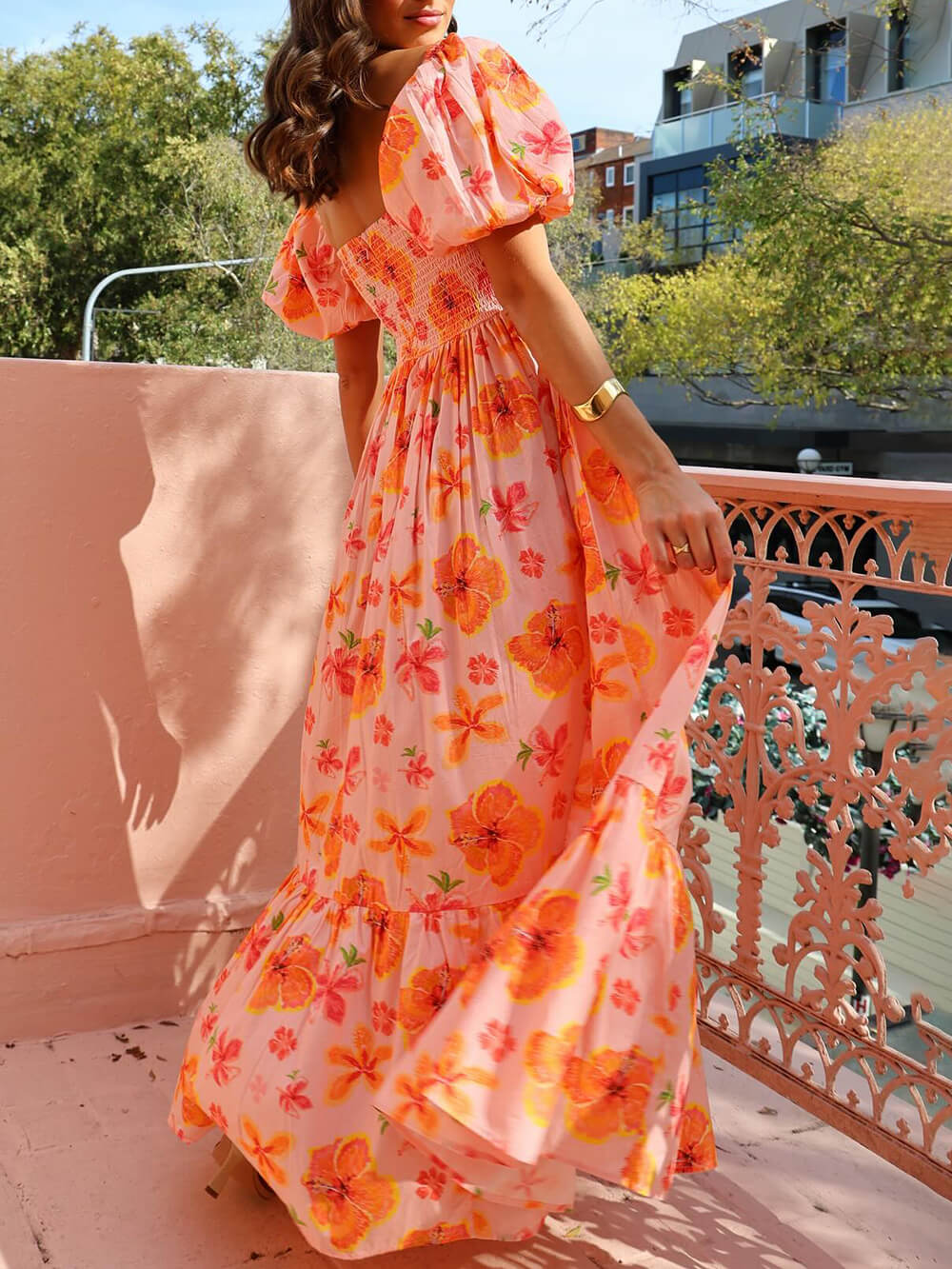 Maxi dress with puff sleeves, floral print, ruched back, and pockets