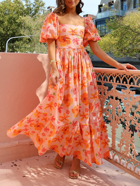Maxi dress with puff sleeves, floral print, ruched back, and pockets