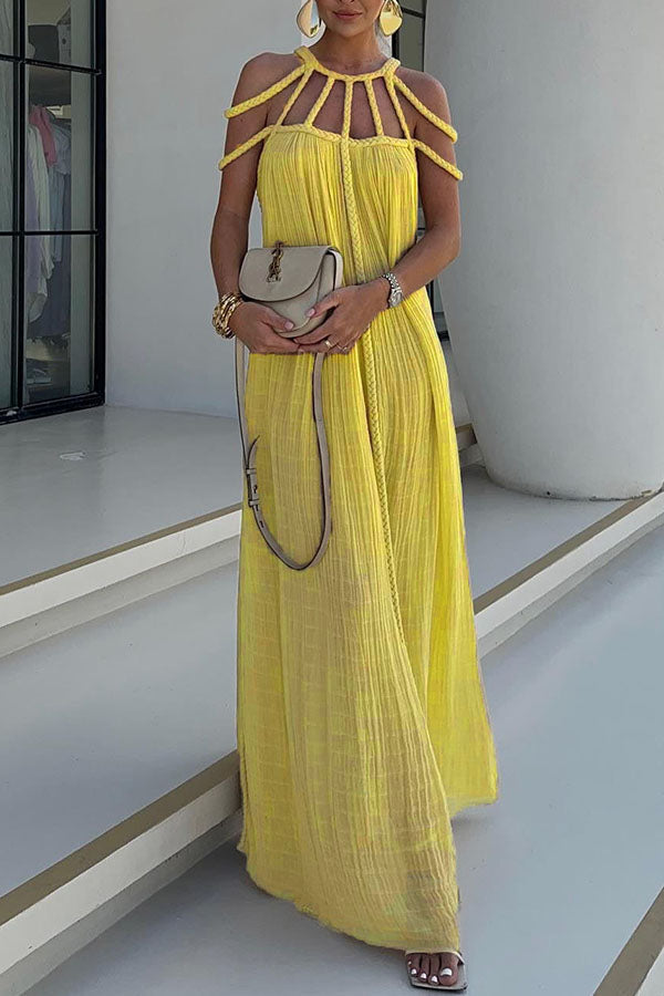 Long pleated dress with cord detailing and an artistic neckline