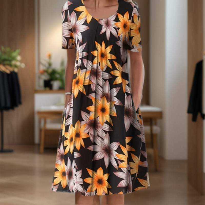 Wide dress with a round neckline, three-quarter sleeves, and a printed design