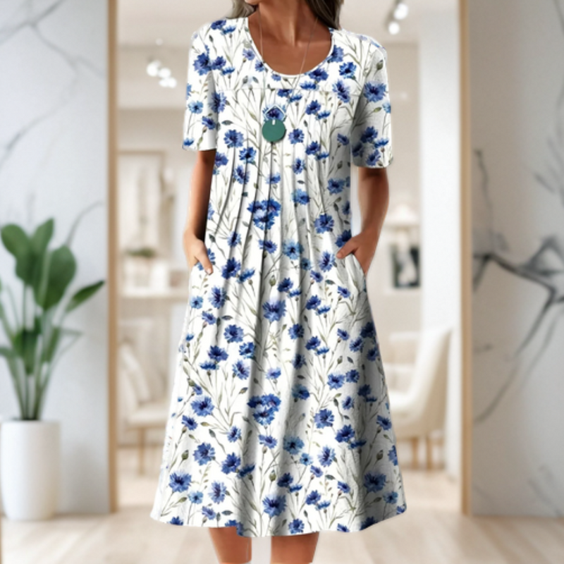 Wide dress with a round neckline, three-quarter sleeves, and a printed design