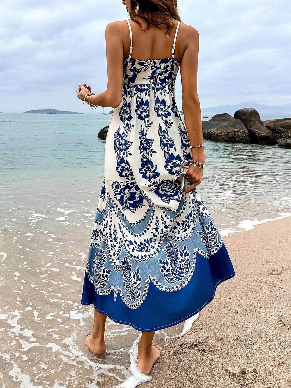 Ethically printed midi dress with a floral pattern, gathered back, and a loose fit