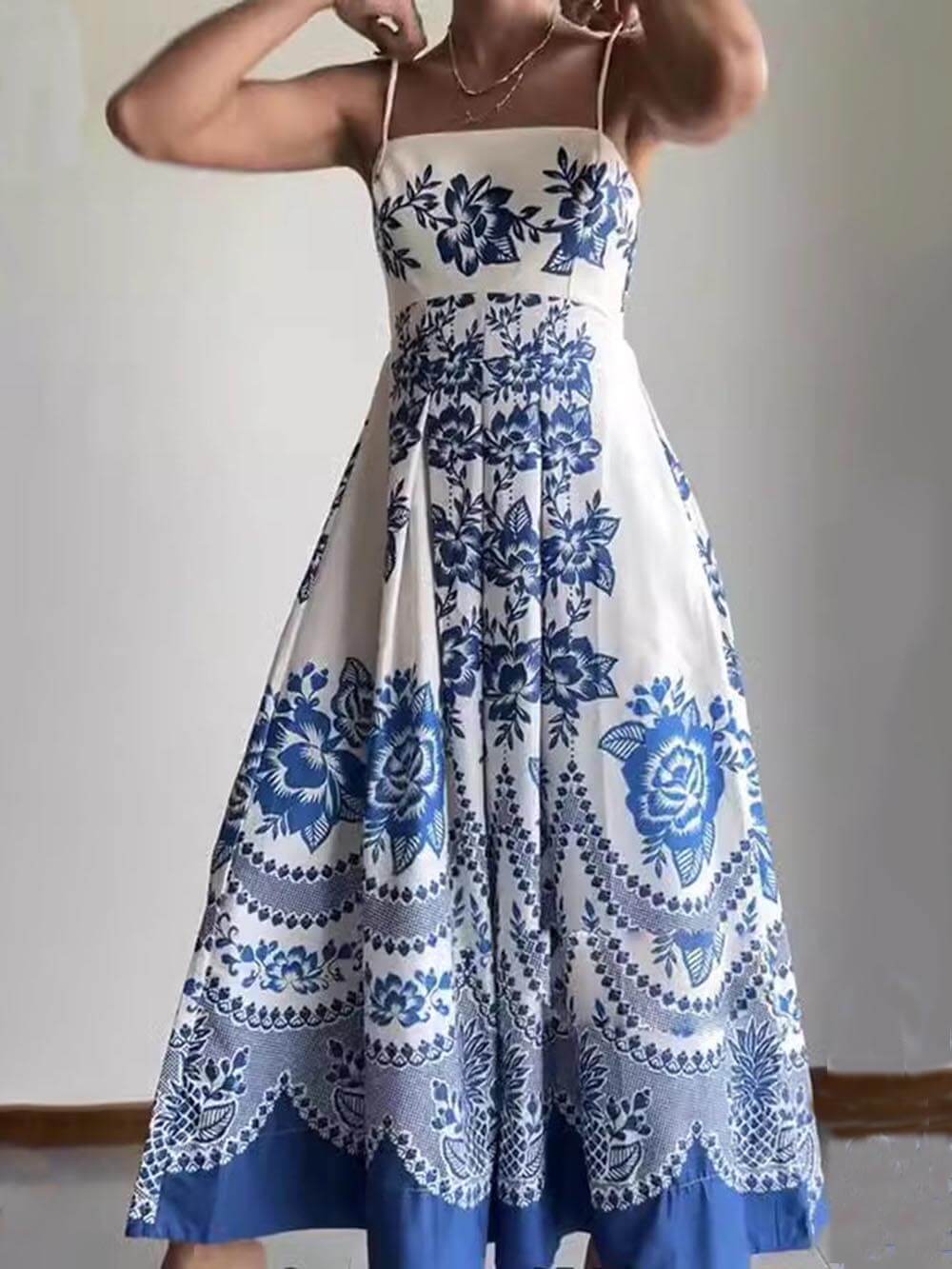 Ethically printed midi dress with a floral pattern, gathered back, and a loose fit