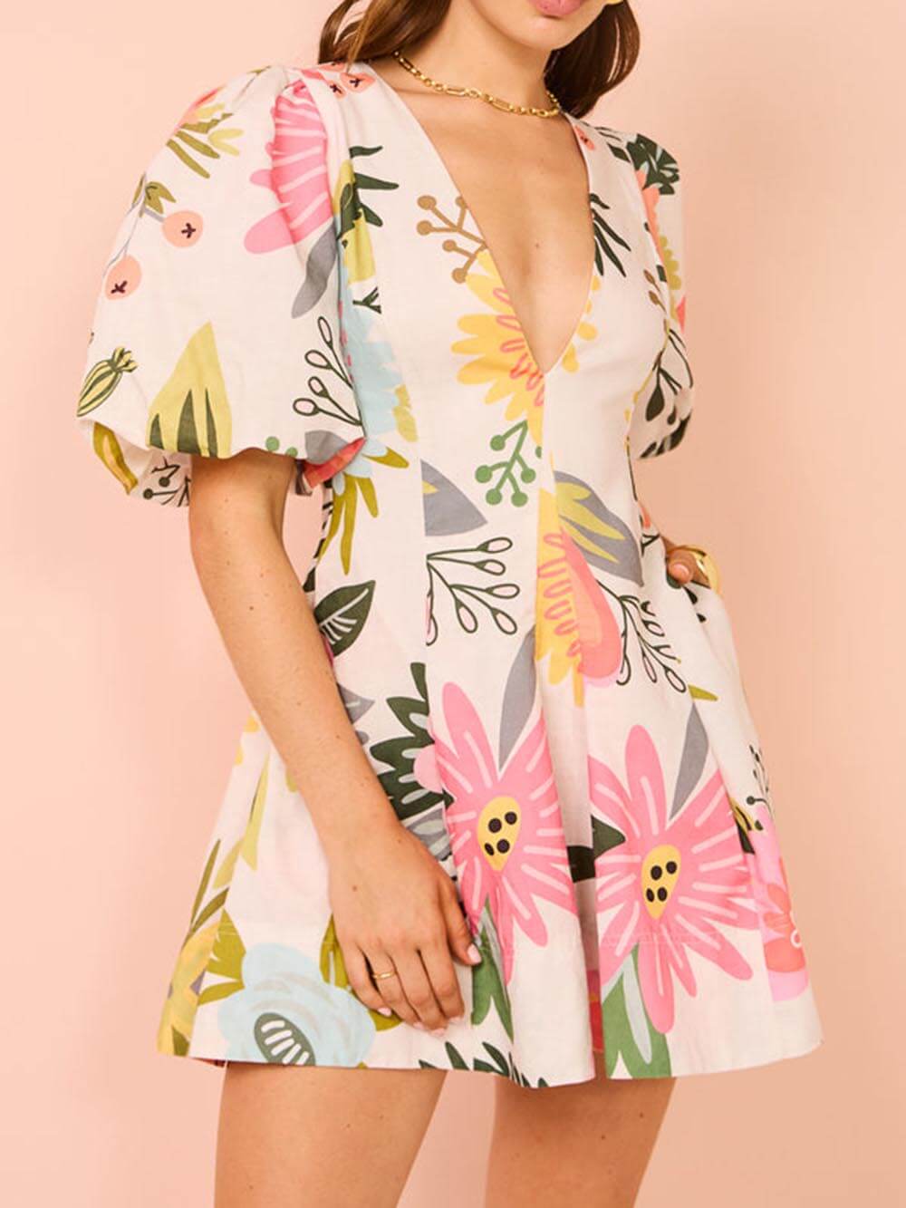 Mini dress with puff sleeves, floral print, and pockets