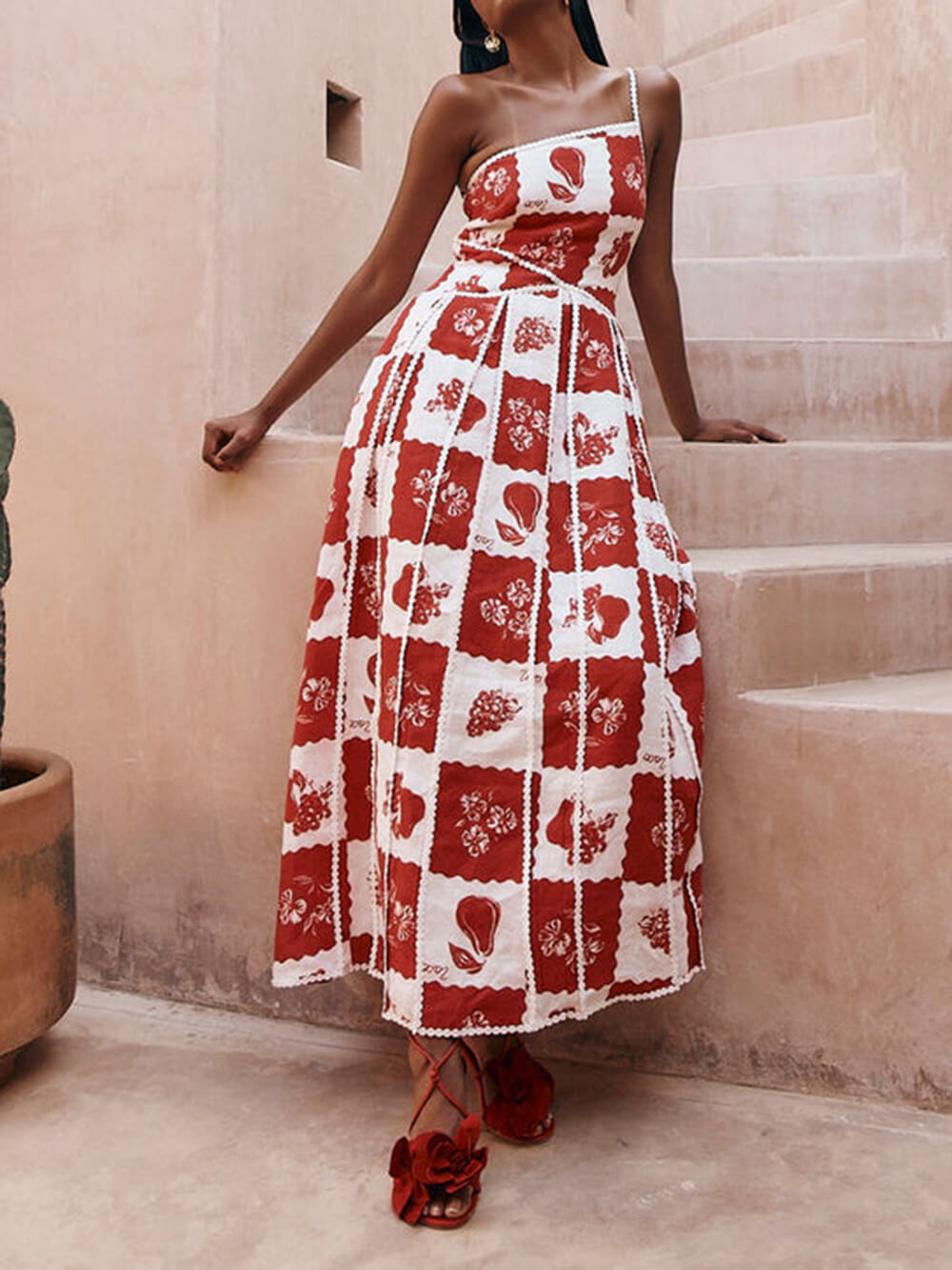 Unique, printed maxi dress with floral trim and one-sided flared cut