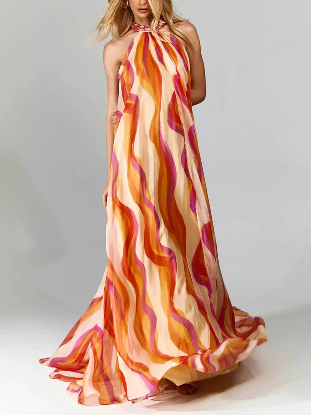 Elegant maxi dress with braided halterneck and wave pattern