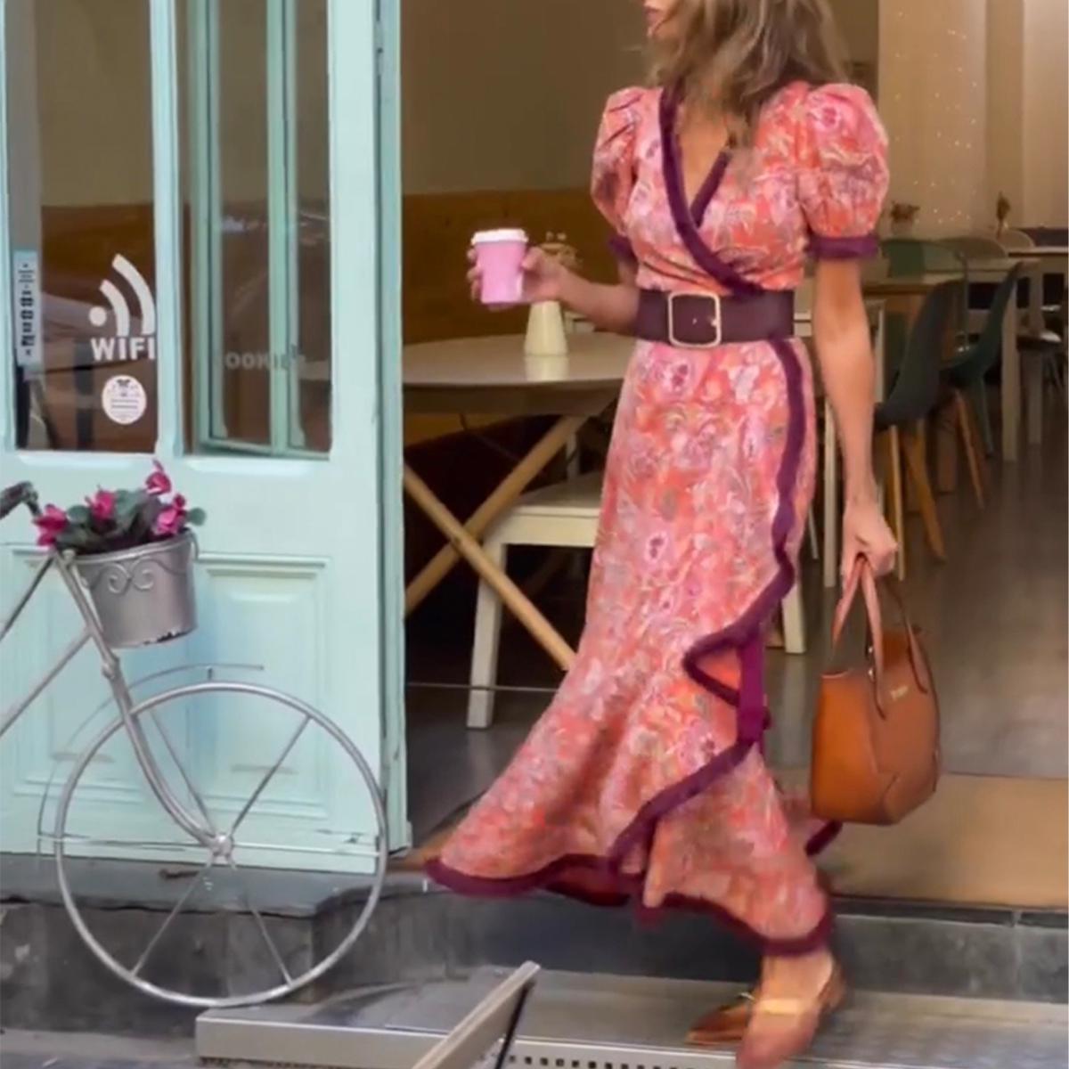 Elegant long dress with short puff sleeves and asymmetrical skirt