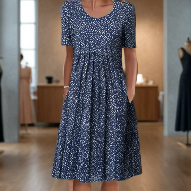 Wide dress with a round neckline, three-quarter sleeves, and a printed design