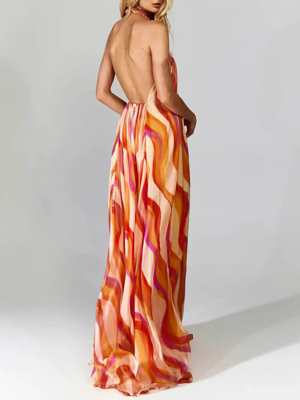 Elegant maxi dress with braided halterneck and wave pattern