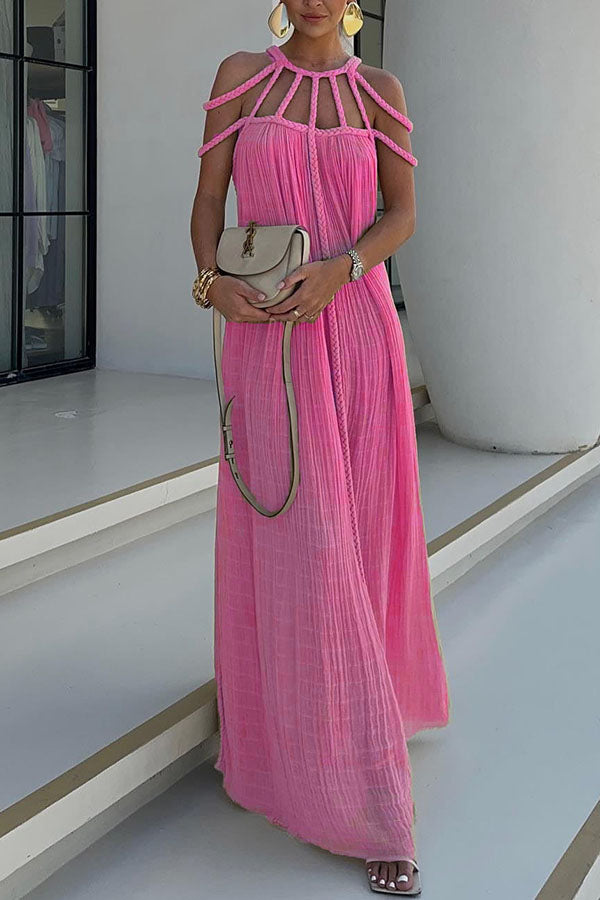 Long pleated dress with cord detailing and an artistic neckline