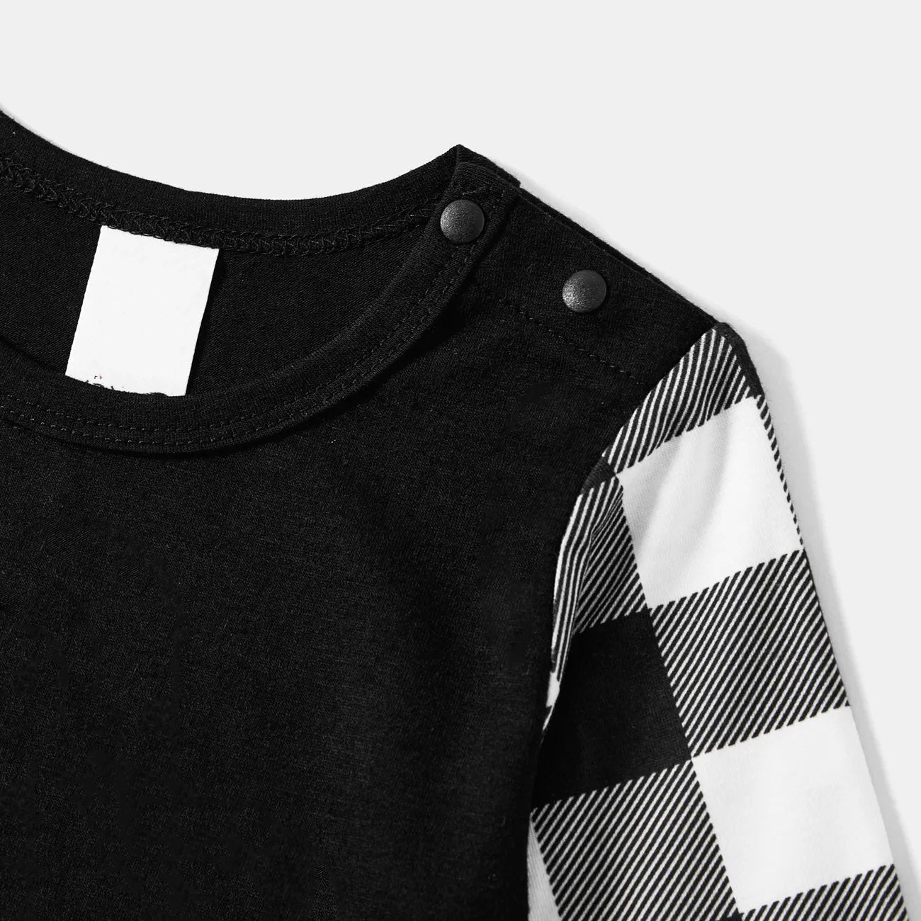 WW | Black and white checkered Christmas pajama set with colorful text print "Christmas crew making memories together"