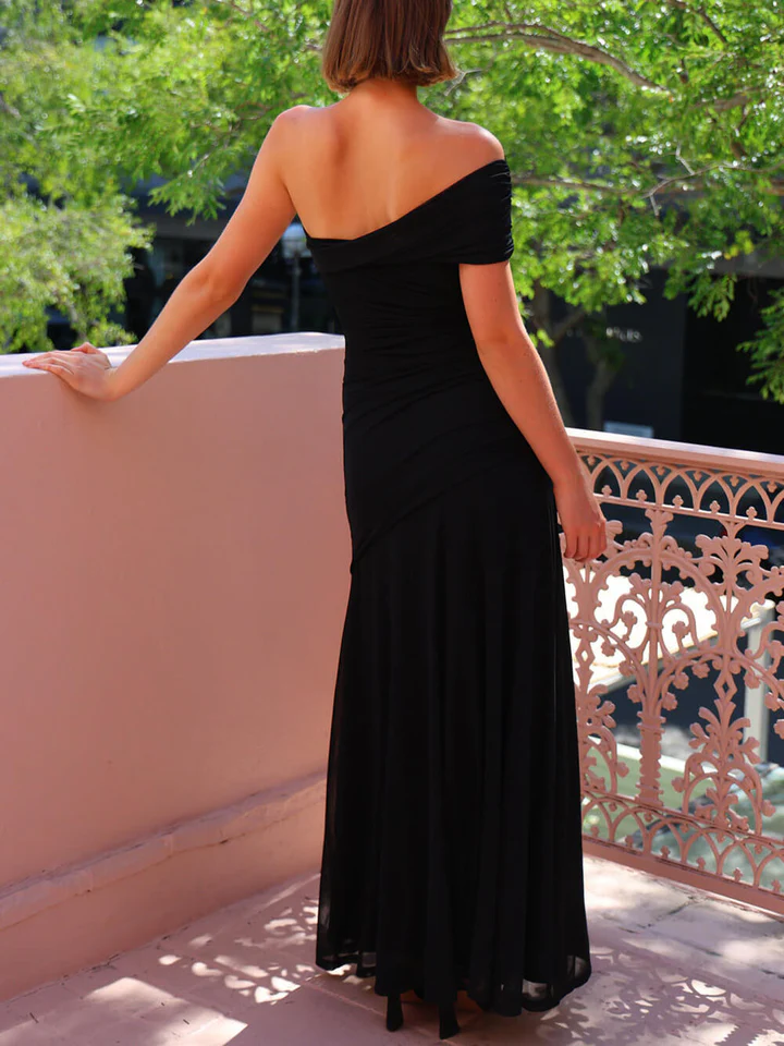 Elegant, effortless mesh maxi dress with an off-the-shoulder neckline, ruching, and stretch