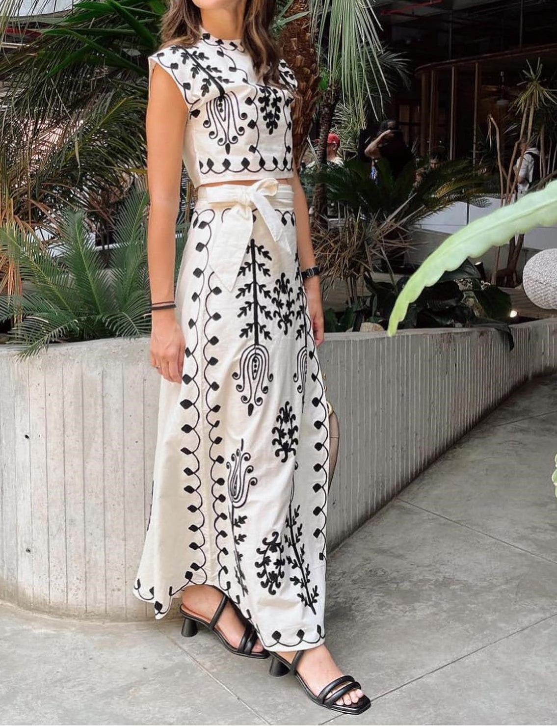Set of a short top and a wrap skirt with an embroidered ethnic print