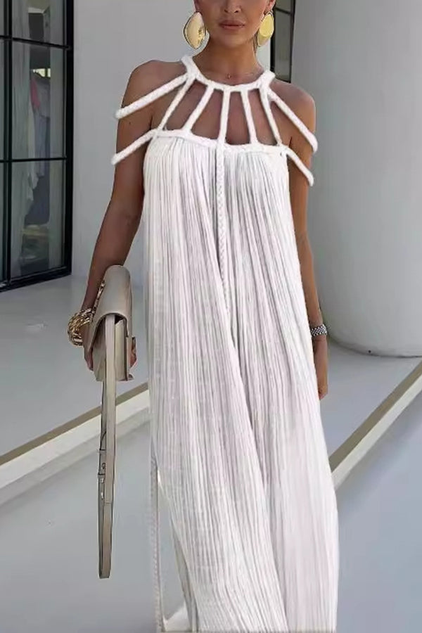 Long pleated dress with cord detailing and an artistic neckline