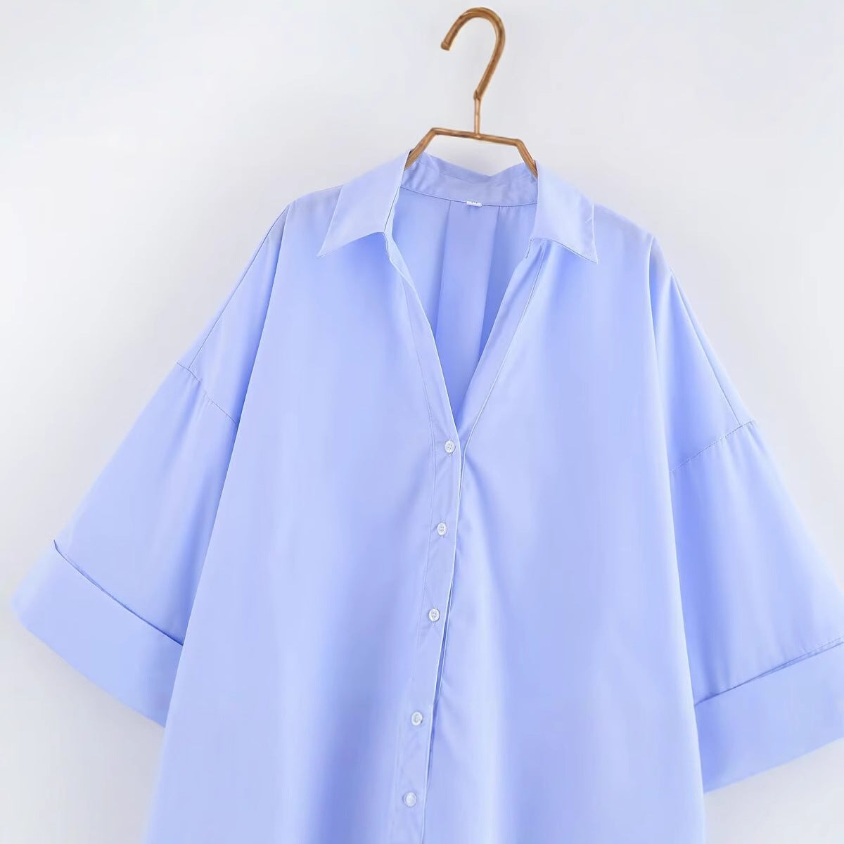 Women's blouse with an oversized cut and stylish lapel WW