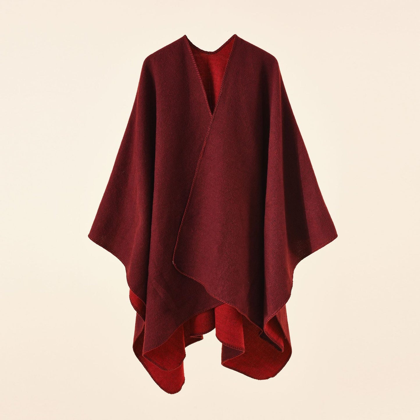 Women's knitted poncho with an asymmetrical cut and high thermal insulation