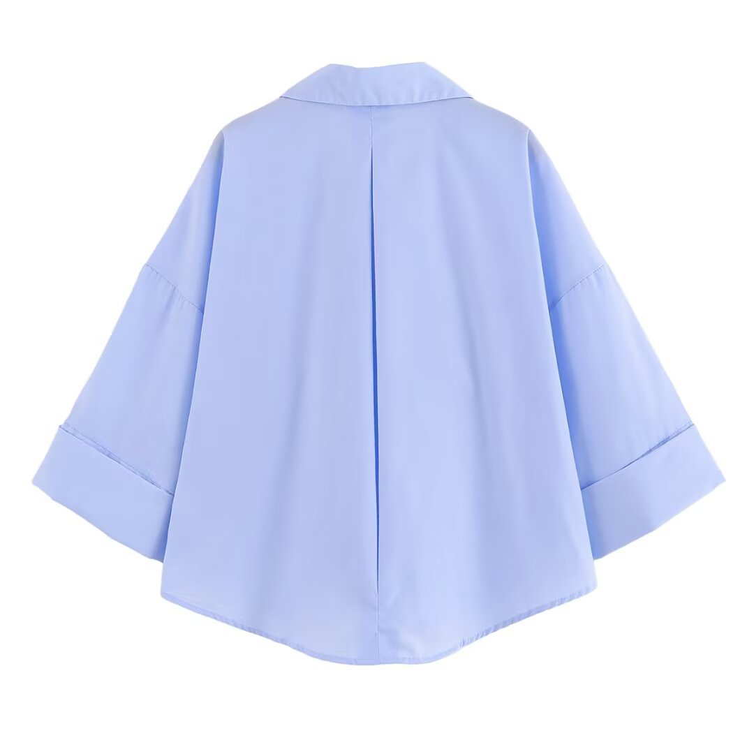 Women's blouse with an oversized cut and stylish lapel WW