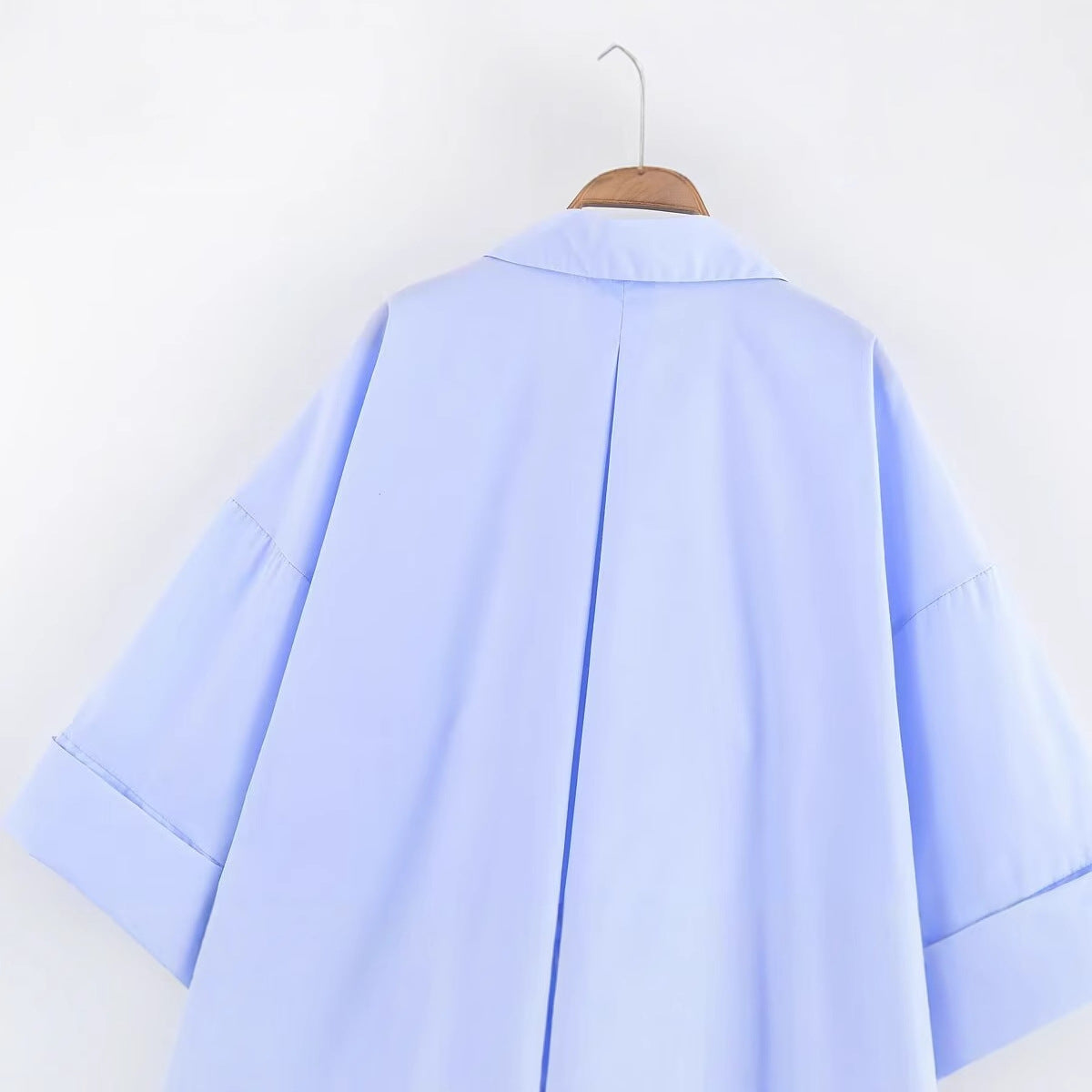 Women's blouse with an oversized cut and stylish lapel WW