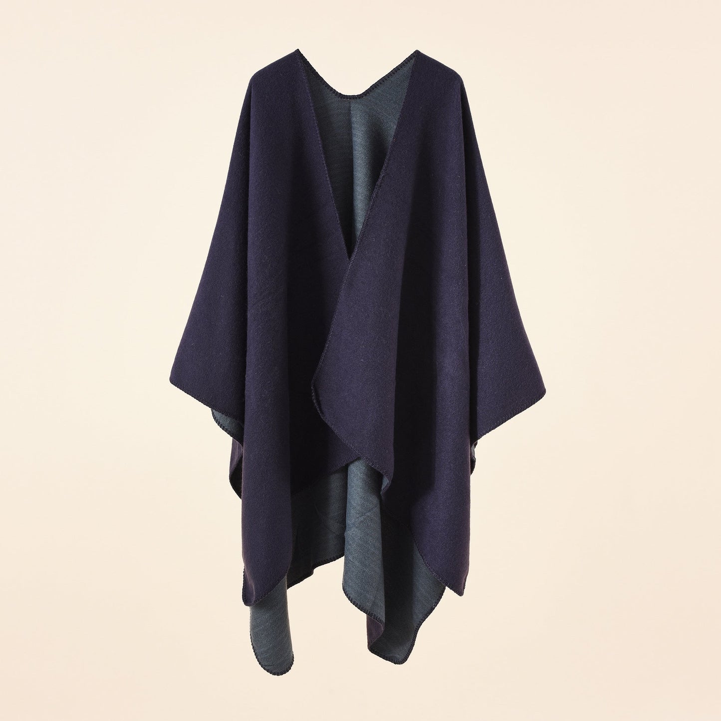 Women's knitted poncho with an asymmetrical cut and high thermal insulation