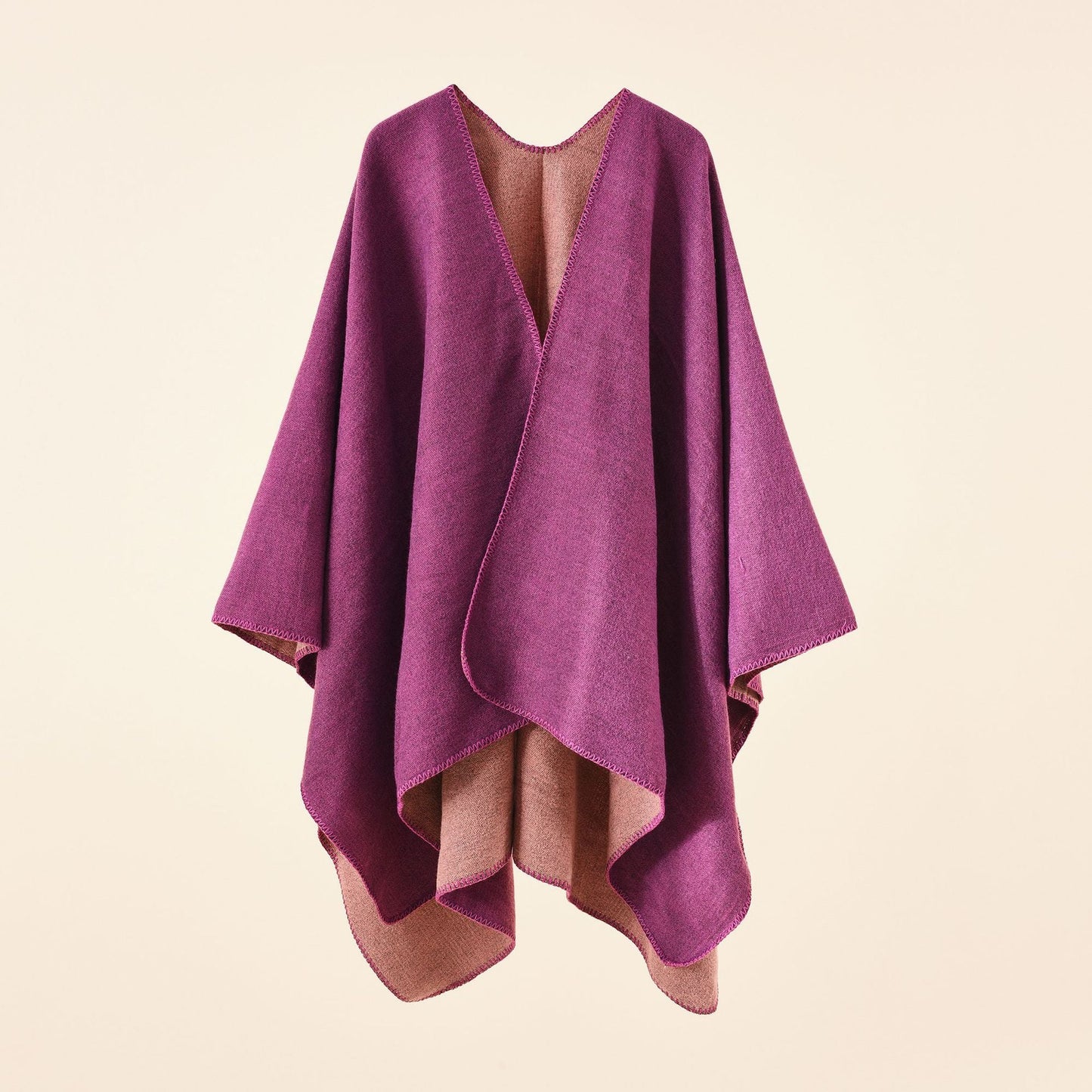 Women's knitted poncho with an asymmetrical cut and high thermal insulation