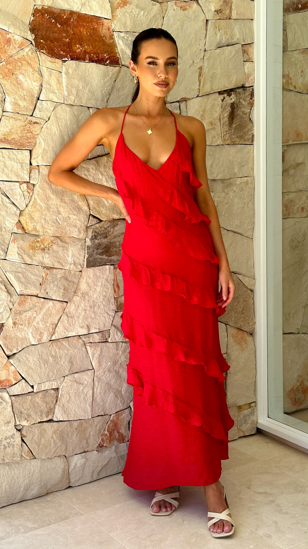 Modern, lightweight long dress with fine drawstring at the neckline and diagonal ruffles