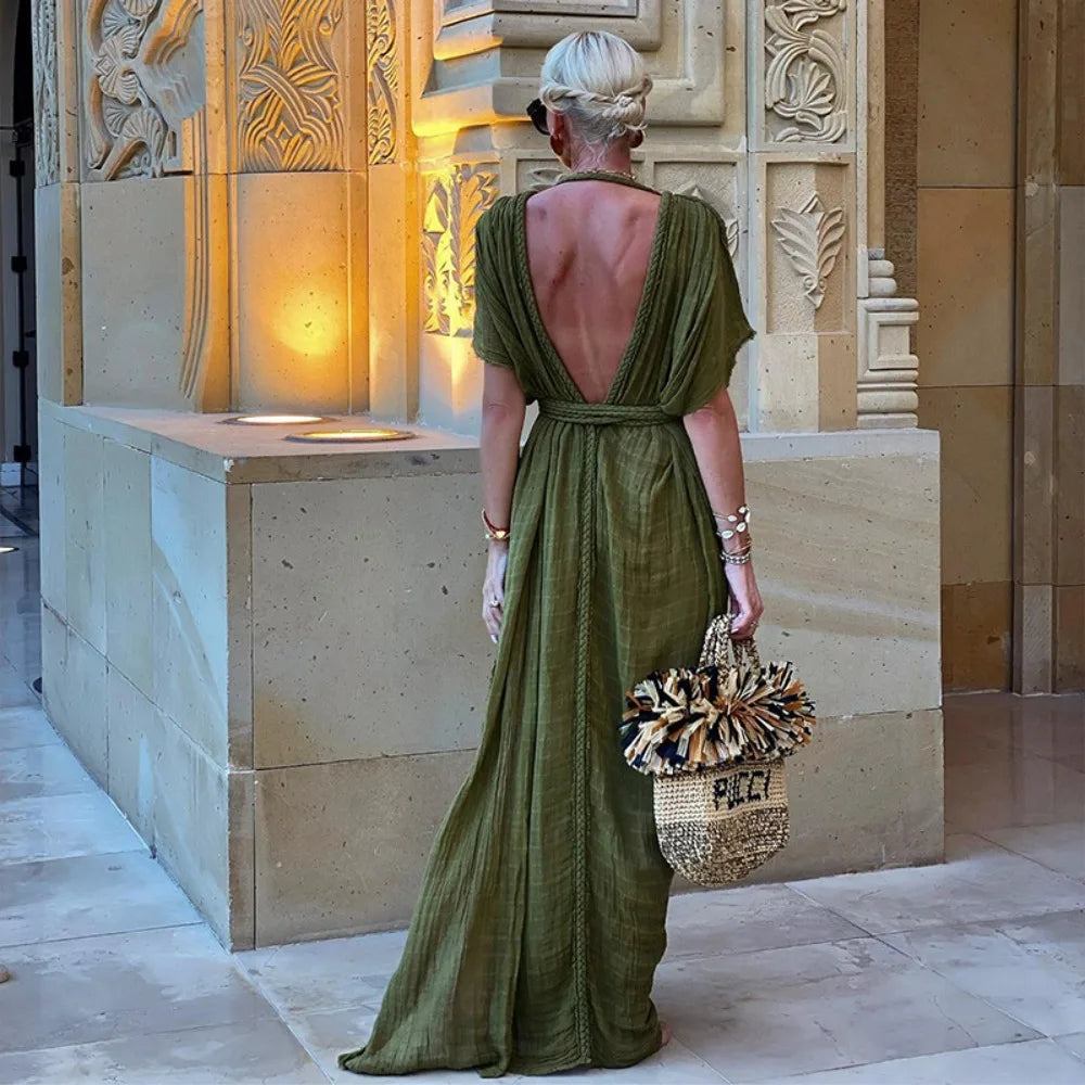 Long, draped Greek-style dress with decorative braided details and kimono sleeves