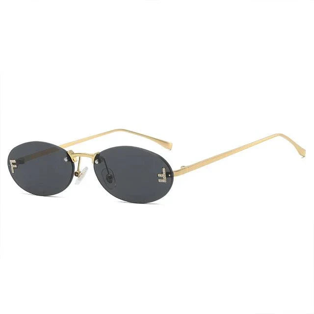 WW | Ovale Sonnenbrille Mit Goldenen Akzenten Und Subtilen Steinen