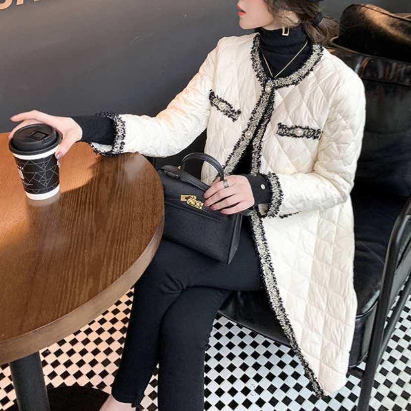 WW | A long women's coat, adorned with pearls