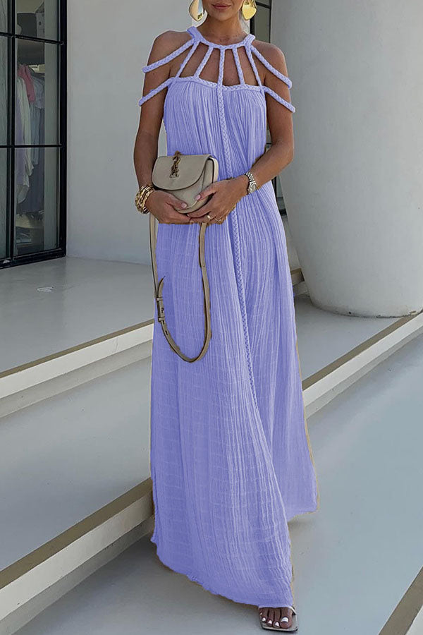 Long pleated dress with cord detailing and an artistic neckline